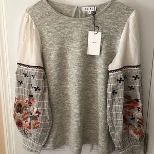 Embroidered lantern sleeve top.